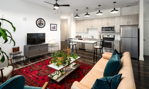 well lit living room with large windows